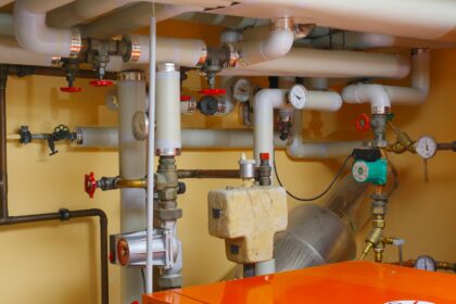 pipes and valves in a room with orange table